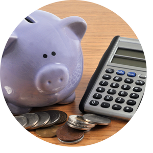piggy bank and calculator on table 